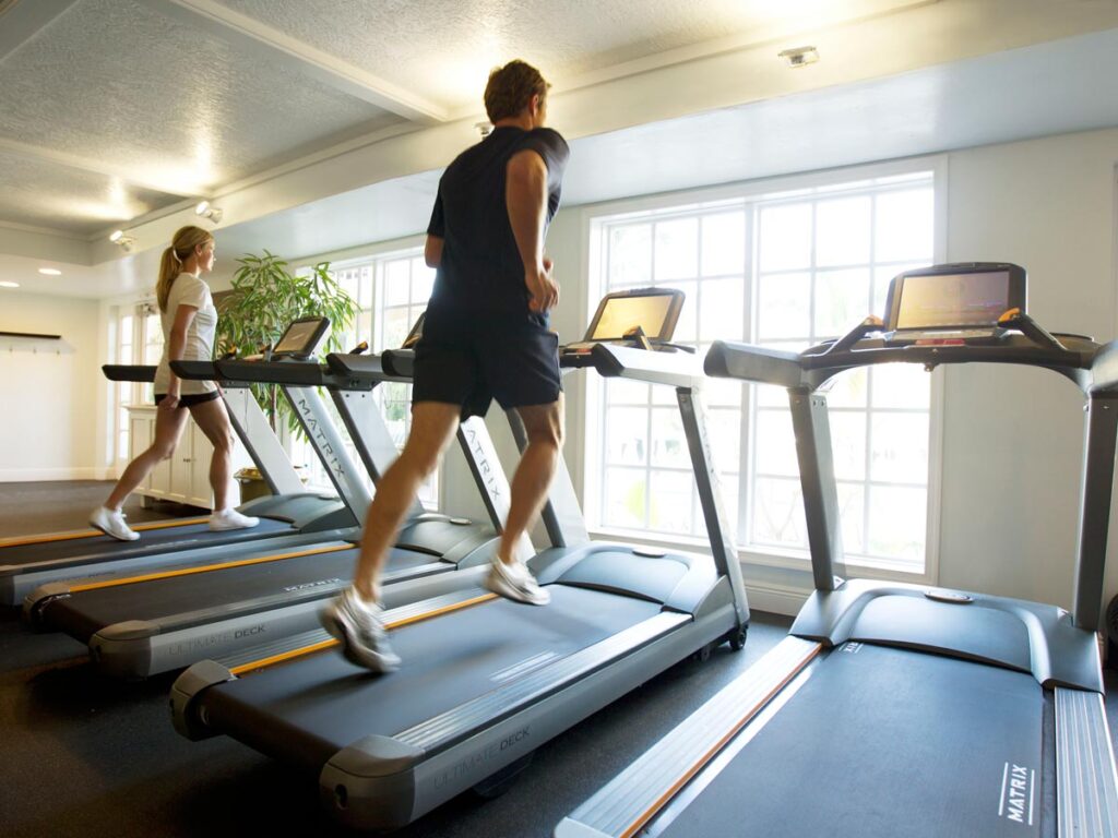 People Exercising On Treadmills.